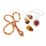 THREE NECKLACES, EARRINGS, A BROOCH AND A PENDANT OF CARNELIAN