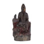 A CHINESE RED AND GOLD LAQUER WOOD SCULPTURE OF BAIYI GUANYIN. EARLY 20TH CENTURY.