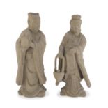 A PAIR OF CHINESE CERAMIC SCULPTURES DEPICTING WAITERS. 20TH CENTURY. A BROKEN NECK.