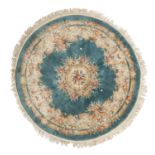 A ROUND CHINESE CARPET. TIEN-TSIN MANUFACTURE 20TH CENTURY.