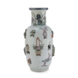 A CHINESE RELIEF DECORATED PORCELAIN VASE. 19TH CENTURY. RESTORATION AT THE NECK.