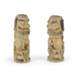 A PAIR OF CHINESE BONE SCULPTURES DEPICTING TWO GUARDIAN LIONS EARLY 20TH CENTURY.