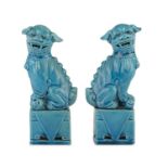 A PAIR OF TURQUOISE GLAZED PORCELAIN SCULPTURES OF BUDDHIST LIONS. CHINA 20TH CENTURY.