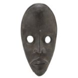 AN AFRICAN IVORY COAST WOODEN DAN CULTURE MASK. 20TH CENTURY.