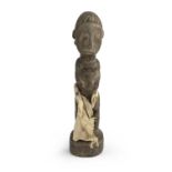 A AFRICAN WOOD SCULPTURE DEPICTING ANCESTOR. 20TH CENTURY.