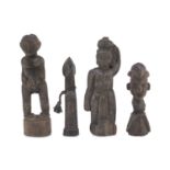 FOUR AFRICAN WOOD SCULPTURES DEPICTING ANCESTOR. 20TH CENTURY.