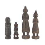 FOUR AFRICAN WOOD SCULPTURES DEPICTING FEMALE FIGURES. 20TH CENTURY.