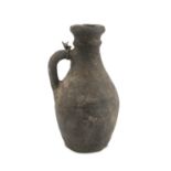 A PERSIAN EARTHERNWARE PITCHER 2ND CENTURY B.C. - 2ND CENTURY A.C.