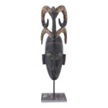 AN IVORY COAST BAULÉ CULTURE WOOD MASK 20TH CENTURY.