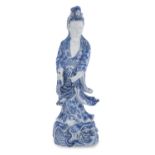 A CHINESE WHITE AND BLUE PORCELAIN SCULPTURE OF GUANYIN. 20TH CENTURY.