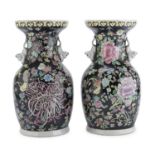 A PAIR OF CHINESE POLYCHROME PORCELAIN VASES. 20TH CENTURY.