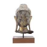 A THAI WOODEN HEAD OF BUDDHA 20TH CENTURY.