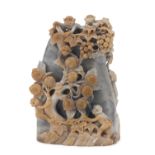 A CHINESE SOAPSTONE GROUP DEPICTING A ROCK WITH MONKEYS. 20TH CENTURY.