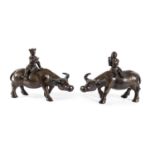 A PAIR OF CHINESE DECORATED BRONZE SCULPTURES OF BUFFALOES WITH CHILDREN. FIRST HALF 20TH CENTURY.