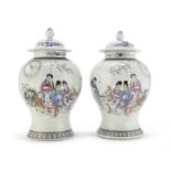 A PAIR OF CHINESE POLYCHROME ENAMELED PORCELAIN JARS WITH LID 20TH CENTURY.