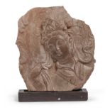A CHINESE TERRACOTTA BAS-RELIEF FRAGMENT DEPICTING GUANYIN 20TH CENTURY.