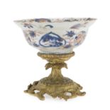A CHINESE POLYCHROME AND GOLD ENAMELED PORCELAIN BOWL WITH BRONZE STAND. 18TH CENTURY.