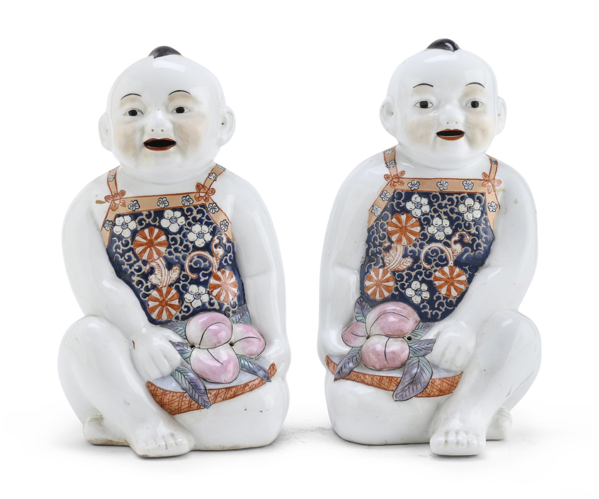 A PAIR OF CHINESE POLYCHROME ENAMELED PORCELAIN CHILDREN SCULPTURES 20TH CENTURY.