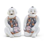 A PAIR OF CHINESE POLYCHROME ENAMELED PORCELAIN CHILDREN SCULPTURES 20TH CENTURY.