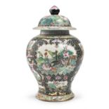 A CHINESE POLYCHROME ENAMELED PORCELAIN JAR WITH LID 20TH CENTURY.