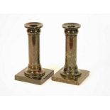 SERPENTINE CANDLESTICKS.