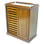 An Edwardian mahogany collectors cabinet, upstand to upper surface, two sliding doors to the front
