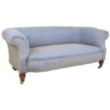 A Victorian Chesterfield two seater settee, upholstered in pale blue fabric, with turned mahogany
