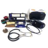 A group of vintage Doctor's GP equipment, including stethoscope, sphygmomanometer, and an