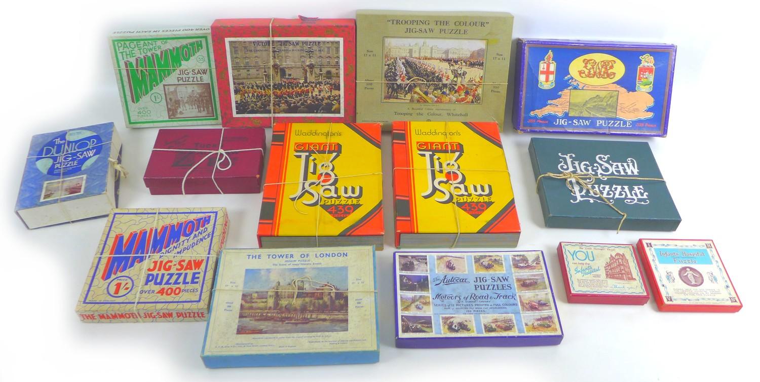 A collection of fourteen vintage mid 20th century puzzles, including two Infants Hospital St.