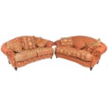 A pair of modern two seater sofas, with red and cream upholstery, each 186 by 100 by 92cm high. (2)