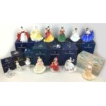 A group of thirteen Royal Doulton and Coalport figurines, all most boxed, comprising twelve Royal