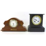 A 19th century marble and black slate striking mantle clock, the enamel dial with black Roman