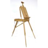 A modern wooden artist's travelling easel, with fold-away legs, and white cotton carry strap, 40.5