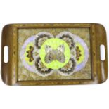 A vintage wooden tray, inset with an arrangement of butterfly wings behind glass.