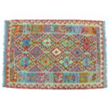 A vegetable dyed wool Choli Kilim rug, with pale green ground, diamond patterned field separated