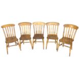 A set of five Victorian oak and beech Windsor chairs, shaped rail above four slat back, the styles