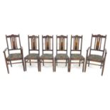 A set of six Edwardian oak dining chairs, 45 by 45 by 106cm high, including two carvers, 54.5 by