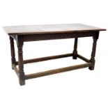 A Tudor style stained oak dining table, possibly 18th century with later four plank top and bread