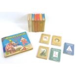 A small library of children's books, including Beatrix Potter, 'Tale of Mrs. Tiggy-Winkle', 'The