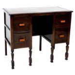 A mid 20th century oak dressing table or small desk, with four drawers, raised on turned legs, 87 by