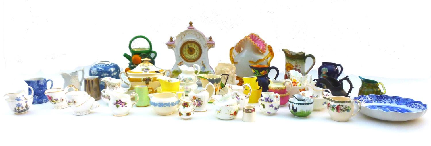 A large group of decorative ceramics including an Austrian clock in the rococo style, decorated with
