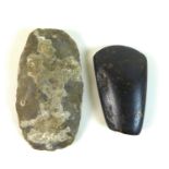 Two Mesolithic hand axes, one found near Cromer, Norfolk, the other found near Warminster,
