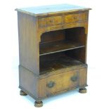 A reproduction mahogany veneered bedside chest, with two frieze drawers over a shelf, and further