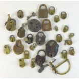 A collection of antique metal and brass padlocks, some with keys, including 'Champion 6-Lever', '