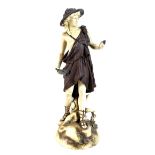 A Rudolstadt ivory porcelain figure modelled as a male dressed in a bear skin and carrying a bird,