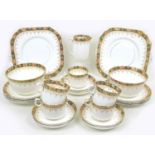 An Edwardian china part tea service, decorated with Imari style border and gilt highlights. (24)