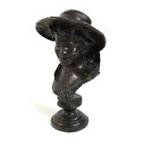 A small bronze head and shoulders bronze bust of a youth wearing a hat, dark brown patina, 18.5cm