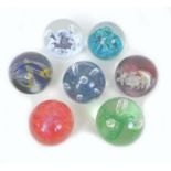 A group of six Caithness glass paperweights, comprising Moonflower, F94328, Moon Orchid, number