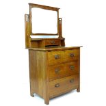 An Art Nouveau style oak dressing chest, Maple & Co London, circa 1930, with mirror, trinket drawer,