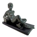 Karin Jonzen FRBS (British, 1914-98): 'Reclining Youth', a bronze figural sculpture with a green